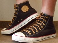 Black and Biscuit High Top Chucks  Wearing black and biscuit high top chucks, left side view 2.